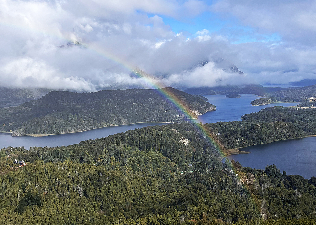 rainbow over lake and forest in Bariloche Argentina