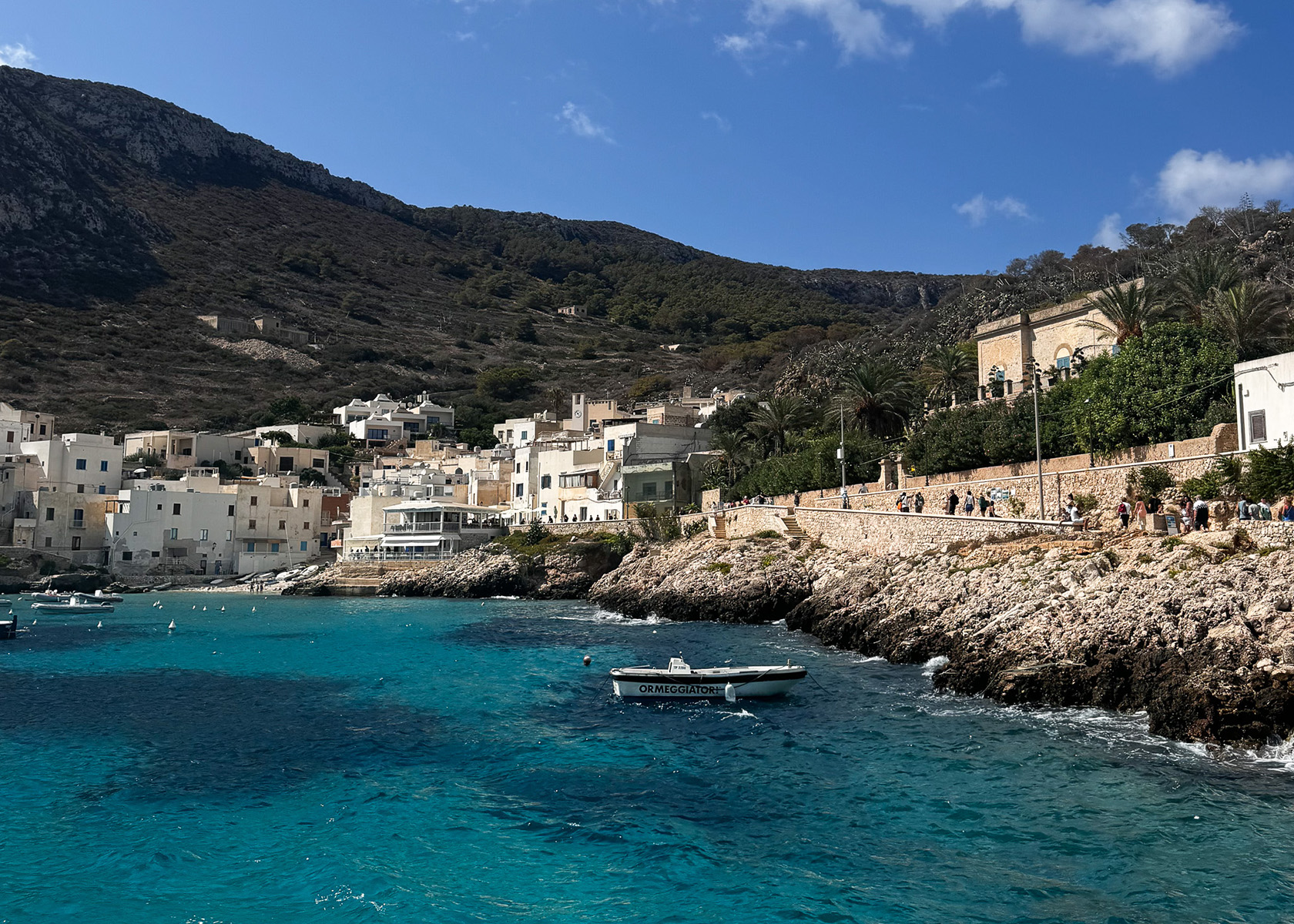 boat on turquoise water Levanzo Island