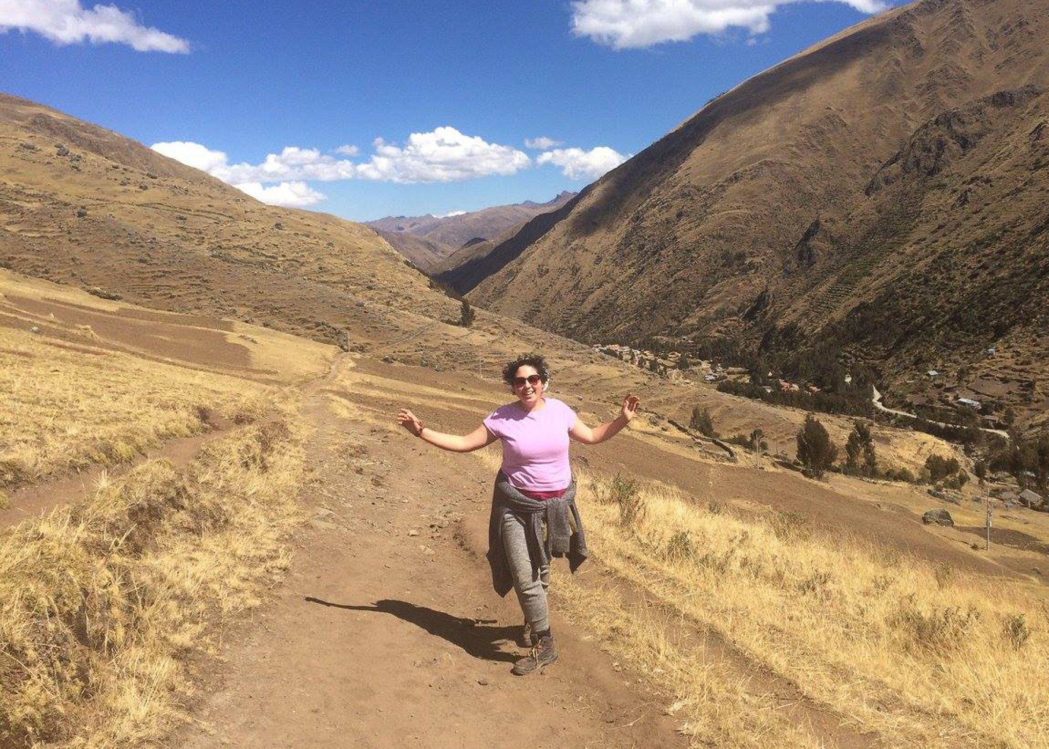 woman hiking in mountains sacred valley Peru